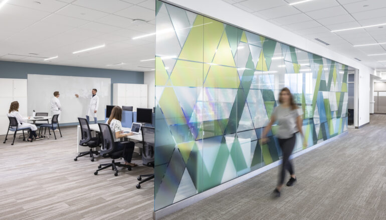 People working in a remodeled collaboration space in the Lifecore offices.