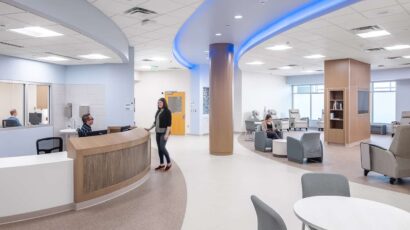 Central nurse station with open access to patient areas and color changing lighting.