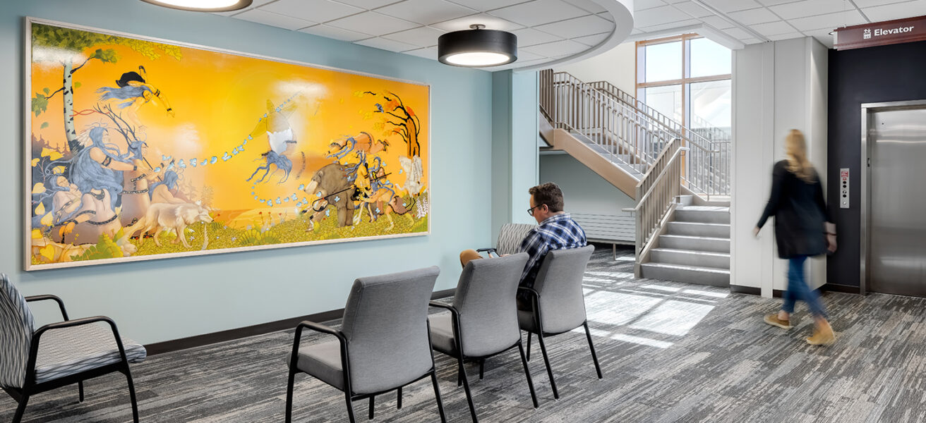 Patients and visitors enter through the main lobby of the surgery center, with a large painting done by a local Native American artist