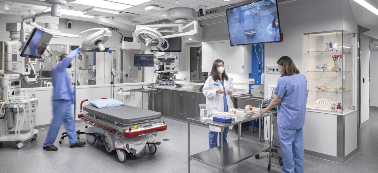 People set up to practice skills at a hands-on operating table simulation at Mayo Clinic.