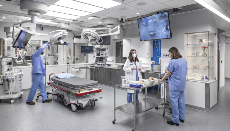 People set up to practice skills at a hands-on operating table simulation at Mayo Clinic.