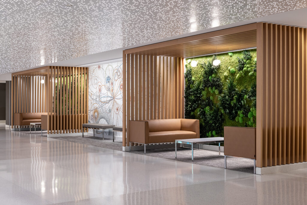 Wood framed pocket alcoves with comfortable leather couches and green walls create places of respite for people on the Mayo Clinic Rochester campus