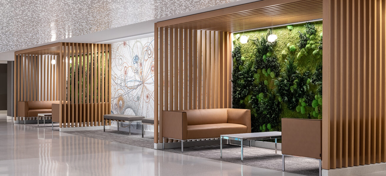 Wood framed pocket alcoves with comfortable leather couches and green walls create places of respite for people on the Mayo Clinic Rochester campus