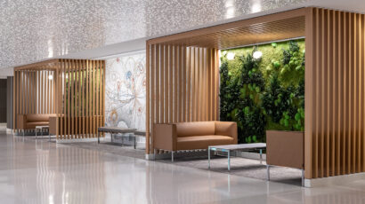 Wood framed pocket alcoves with comfortable leather couches and green walls create places of respite for people on the Mayo Clinic Rochester campus