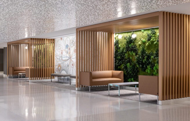 Wood framed pocket alcoves with comfortable leather couches and green walls create places of respite for people on the Mayo Clinic Rochester campus