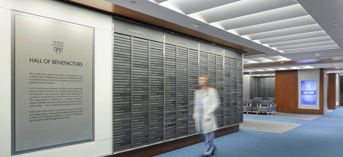 A person walking through the Mayo Clinic Hall of Benefactors.