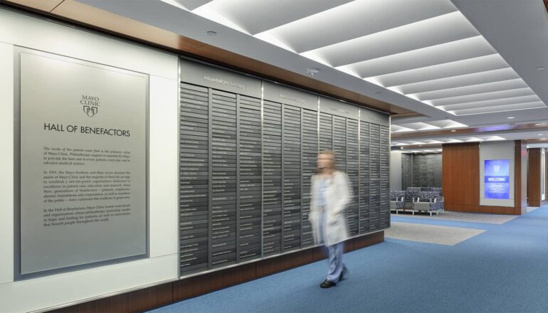 A person walking through the Mayo Clinic Hall of Benefactors.