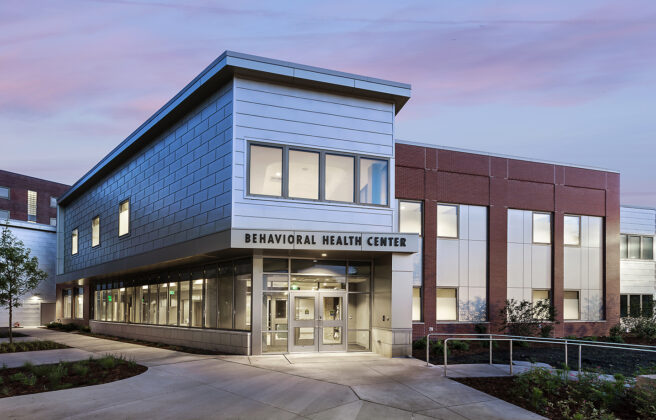 The main entry to the MercyOne North Iowa behavioral health unit at dusk