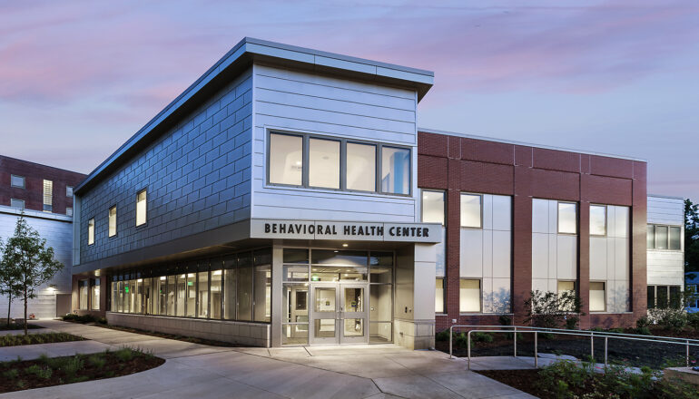 The main entry to the MercyOne North Iowa behavioral health unit at dusk