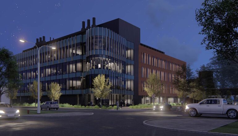 A nighttime rendering of Science Hall with illuminated interior rooms.
