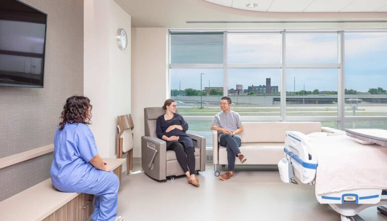 A family enjoying the seating space in a post op room.
