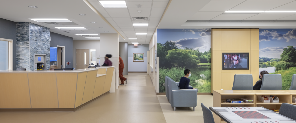 The main lobby of the Regions Inpatient Mental Health Center third floor features a nurse station, game tables, and a large TV