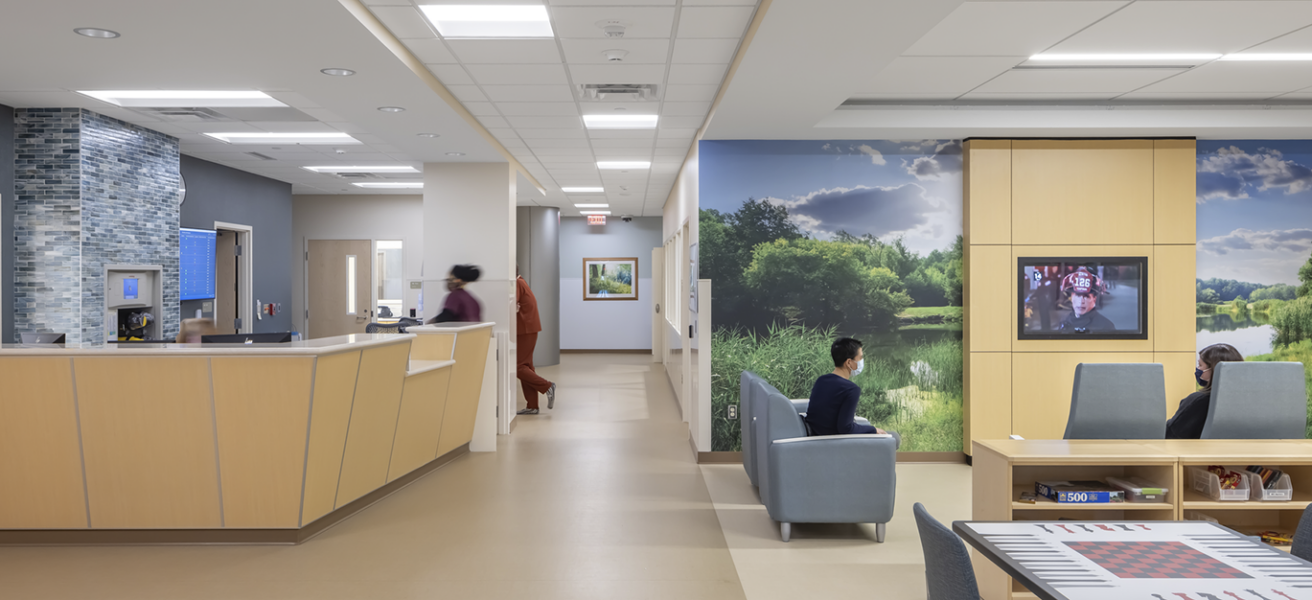 The main lobby of the Regions Inpatient Mental Health Center third floor features a nurse station, game tables, and a large TV