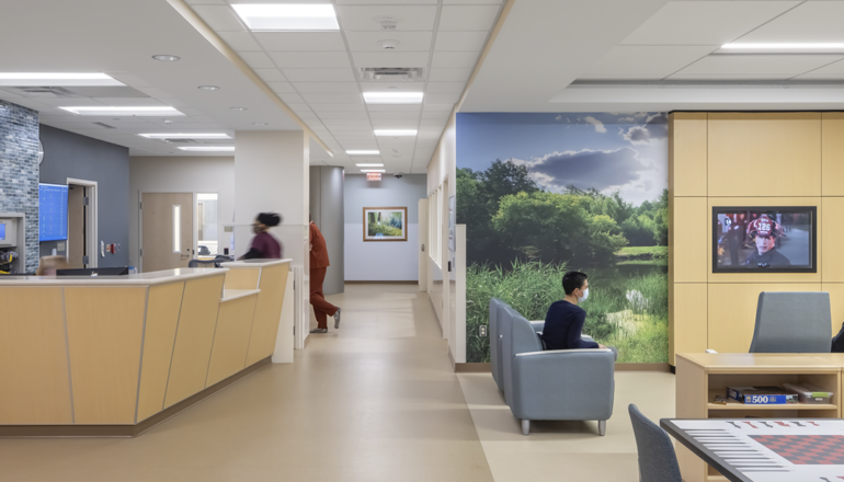 The main lobby of the Regions Inpatient Mental Health Center third floor features a nurse station, game tables, and a large TV