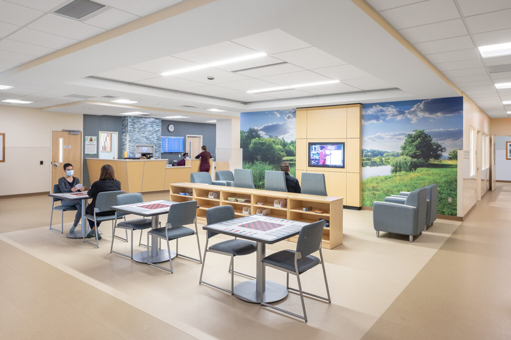 The main lobby of the Regions Inpatient Mental Health Center third floor features a nurse station, game tables, and a large TV