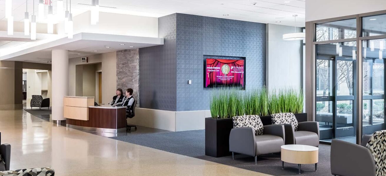 Inside the new entry's lobby, complete with reception desk and comfortable waiting areas.