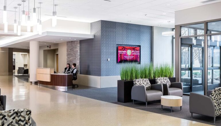 Inside the new entry's lobby, complete with reception desk and comfortable waiting areas.