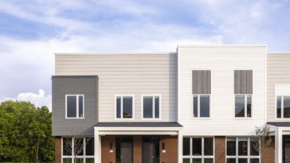 An exterior, head-on view of the Seton Townhome front entries in the Flynntown Village