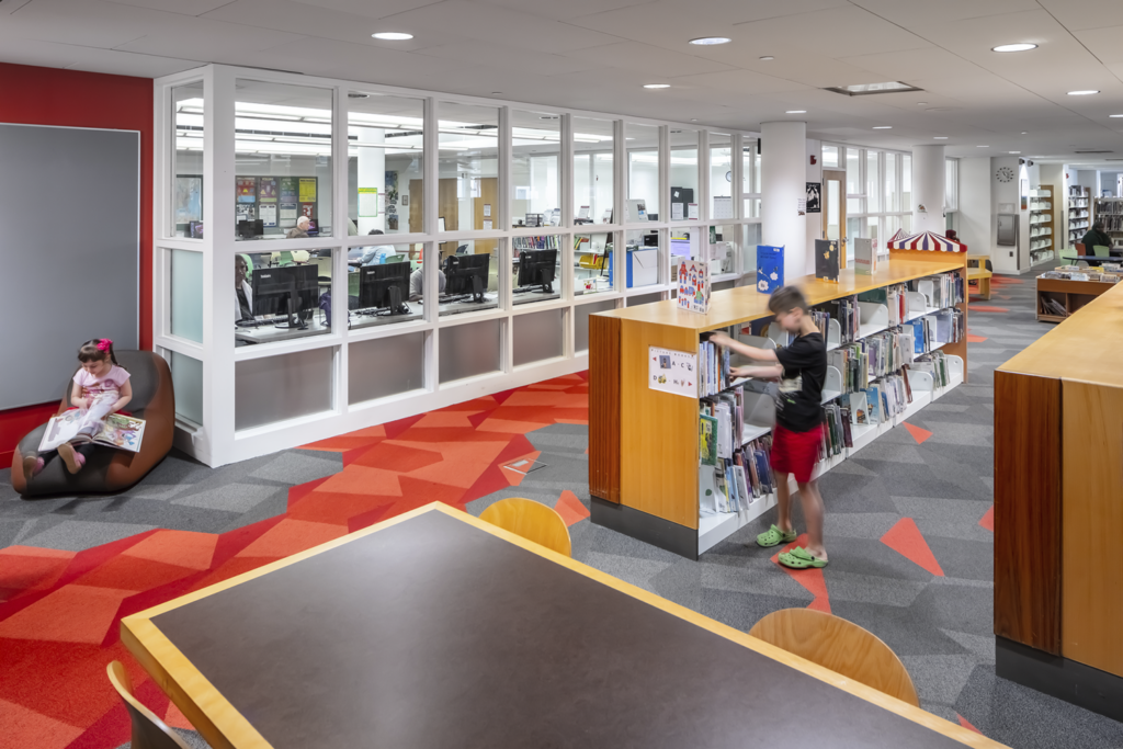 Children read in the children's section of the Rondo Library.