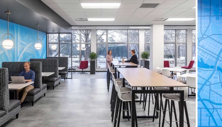 An open work cafe with flexible seating options and views to nature.