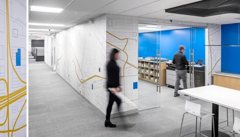 An environmental wall graphic highlighting a corridor that leads to a shared print room.