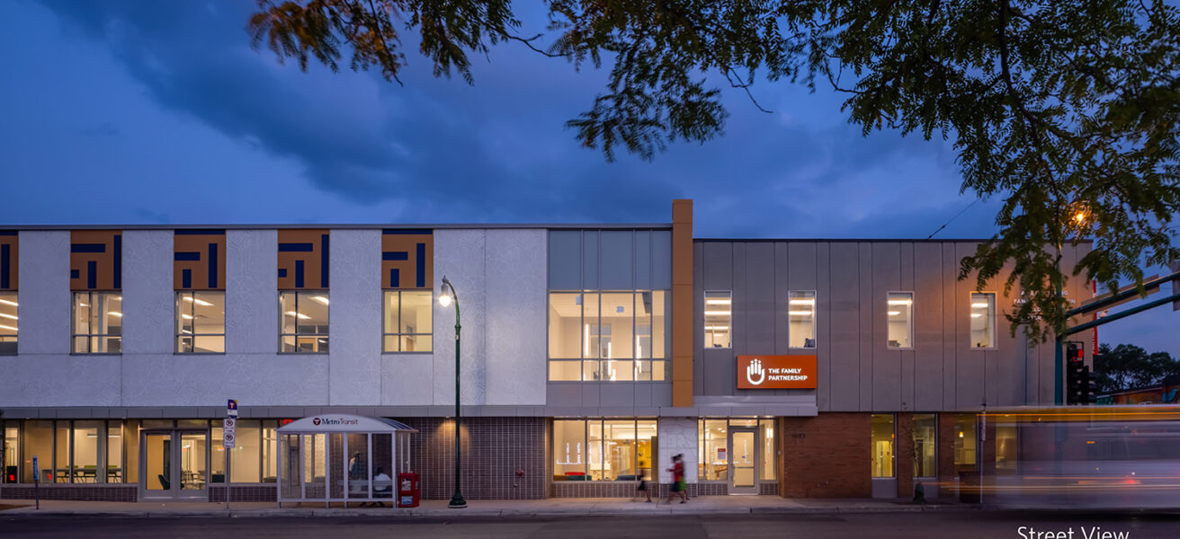 A street view at dusk of The Family Partnership's social services headquarters.