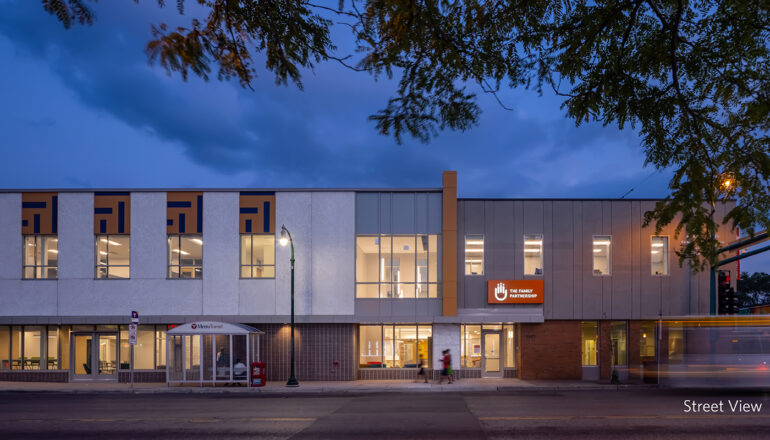 A street view at dusk of The Family Partnership's social services headquarters.