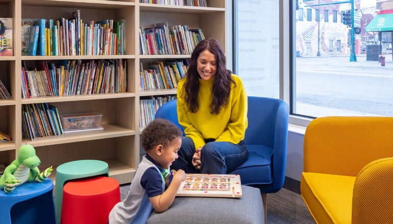 A quiet library sitting area for families to read and borrow books.