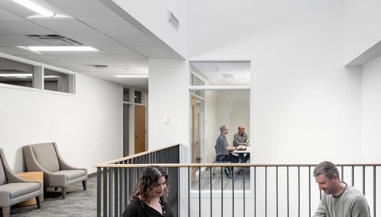 A waiting and common space with a large skylight.