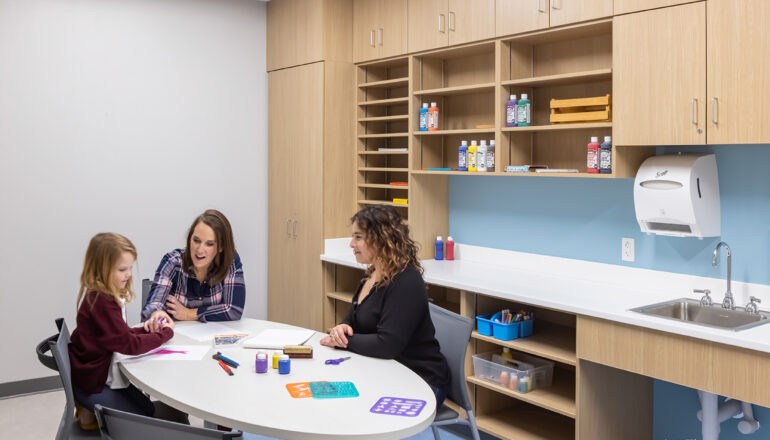 People utilizing the art therapy room.