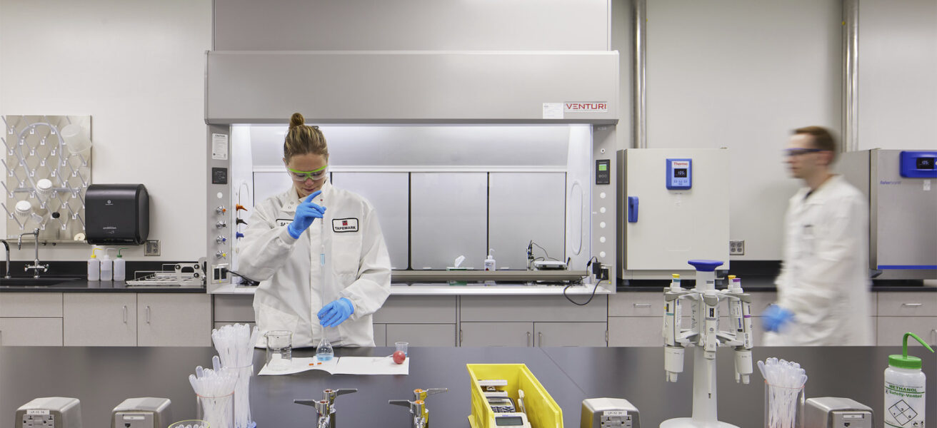 People perform tests in a Tapemark cleanroom.