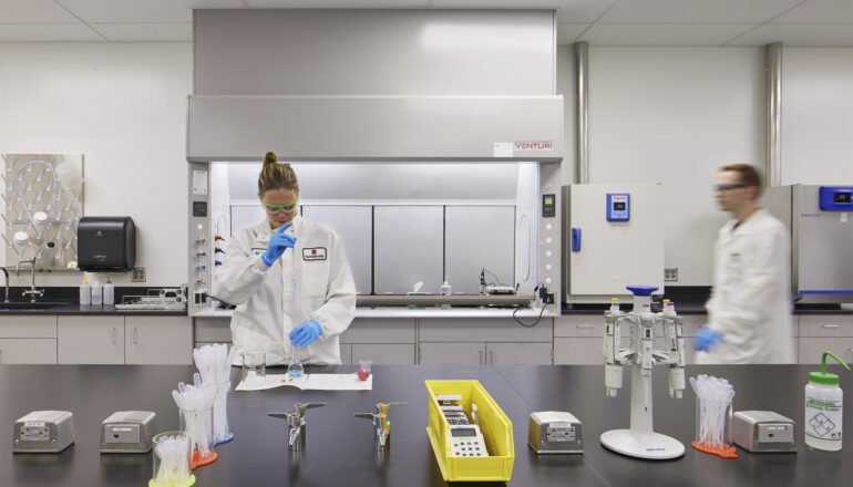 People perform tests in a Tapemark cleanroom.
