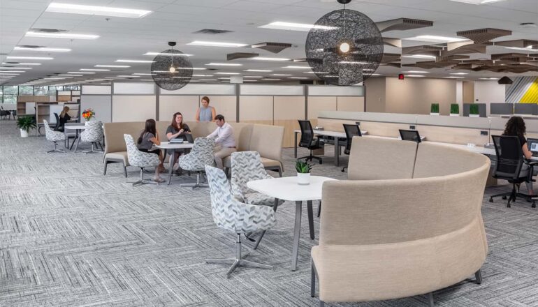 Semi-private workspace with touchdown seating and mid-height cubicles.