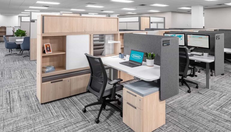 A semi-private cubicle workstation with a lowered desk.