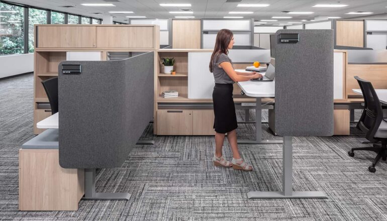 A semi-private cubicle workstation with a raised desk.