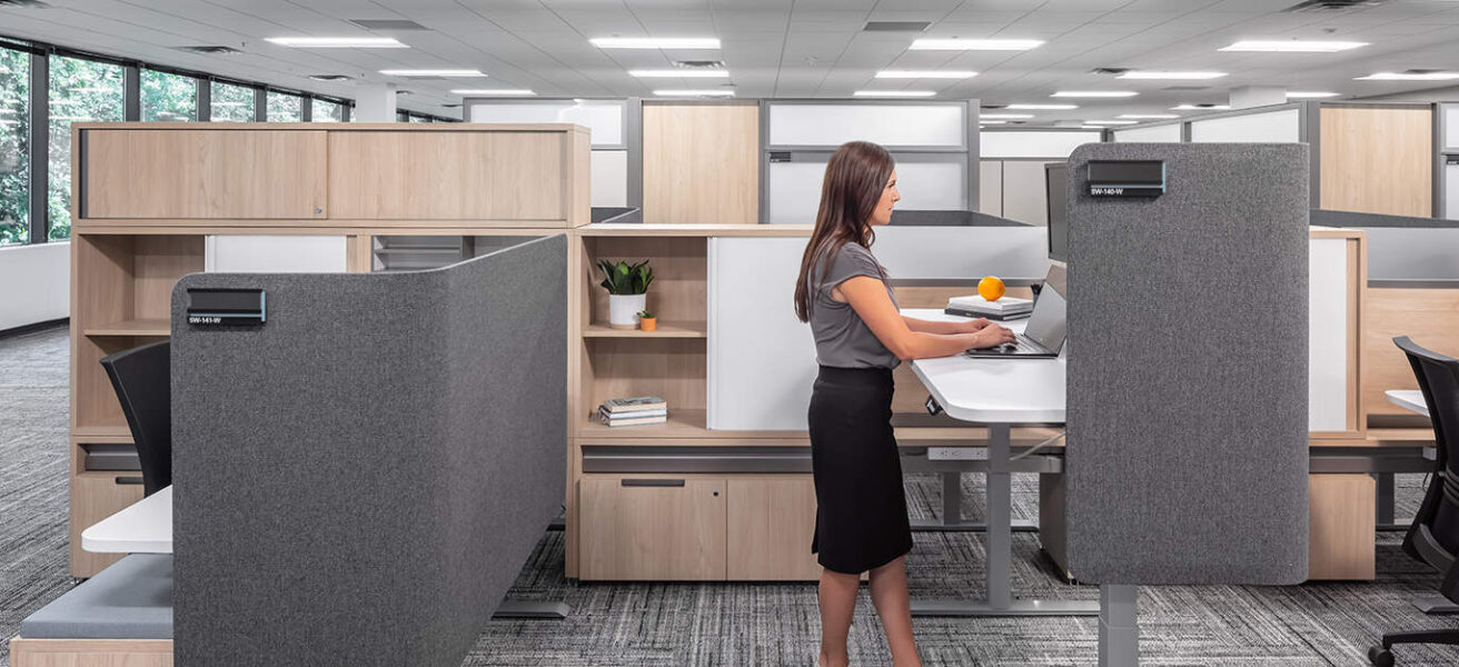 A semi-private cubicle workstation with a raised desk.