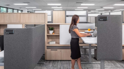 A semi-private cubicle workstation with a raised desk.