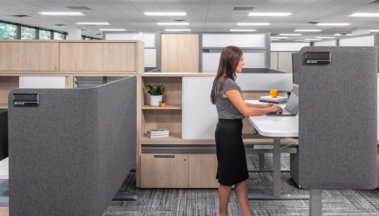 A semi-private cubicle workstation with a raised desk.