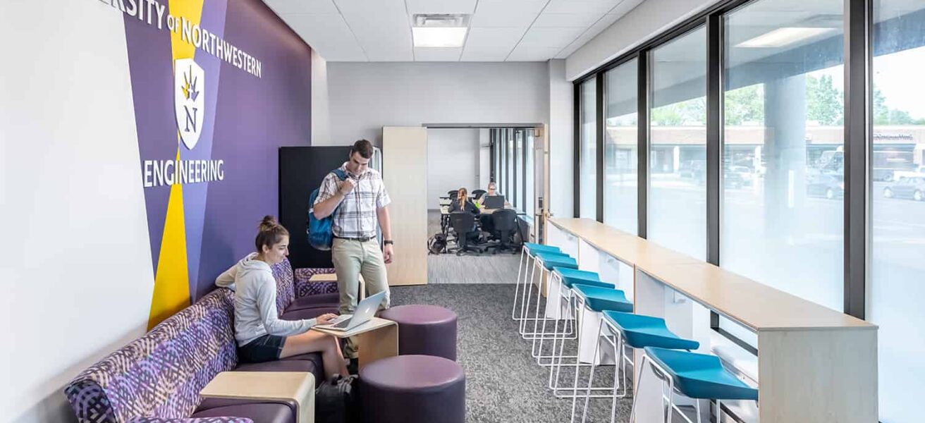 A branded breakout workspace in the entry to the engineering classroom facility.