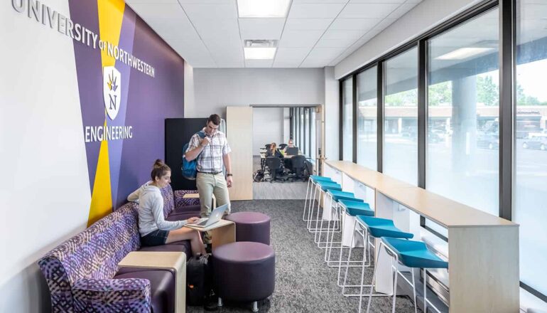 A branded breakout workspace in the entry to the engineering classroom facility.