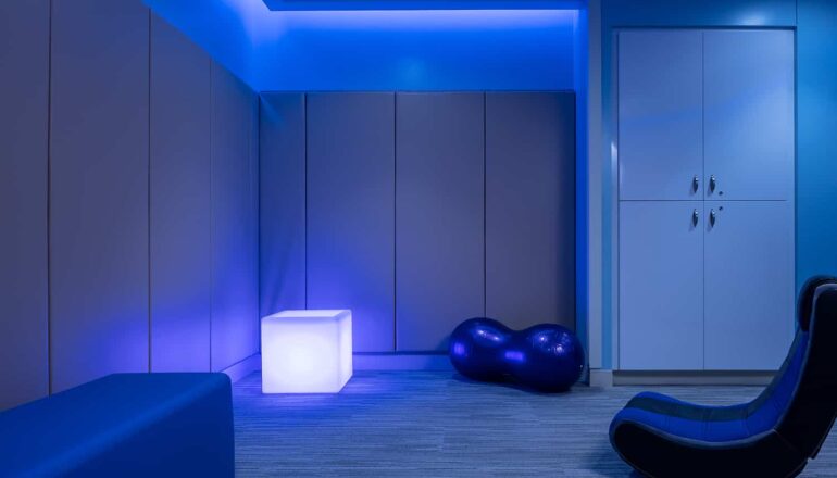 Sensory room with blue lighting.