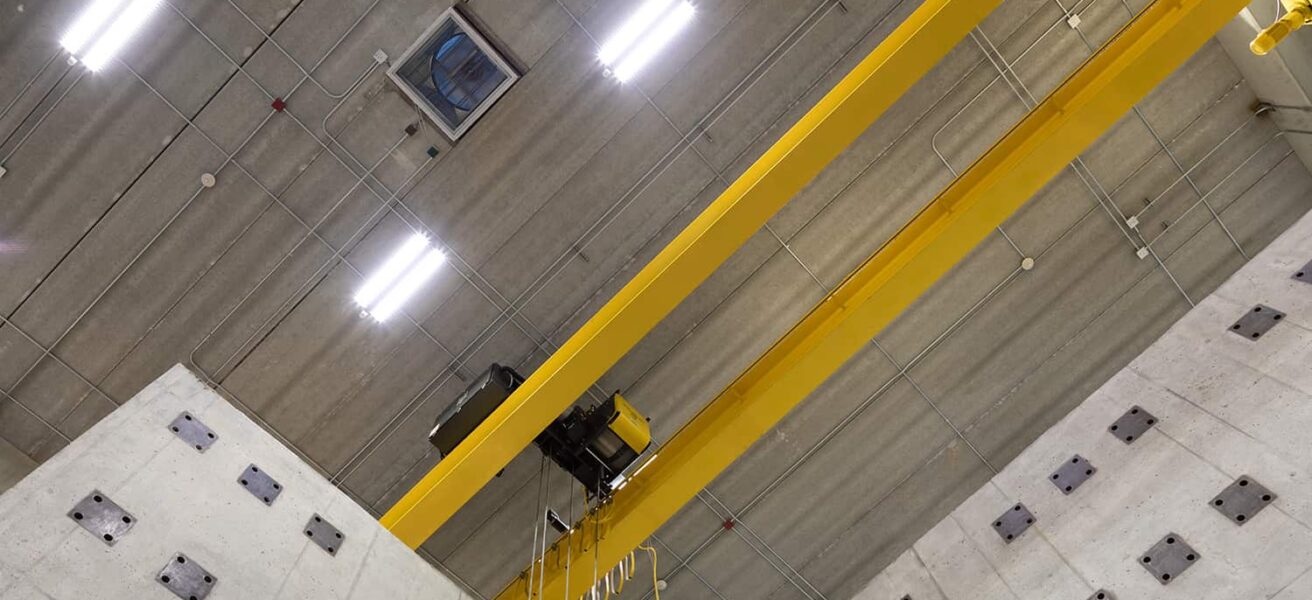 A ceiling view of the yellow interior structures testing crane.