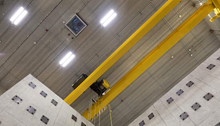 A ceiling view of the yellow interior structures testing crane.