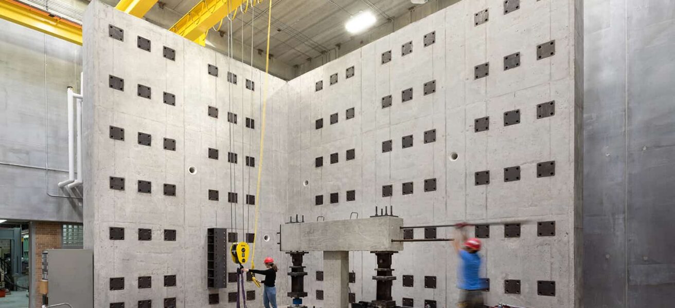 An overall view of the materials and structures testing laboratory with engineering students.