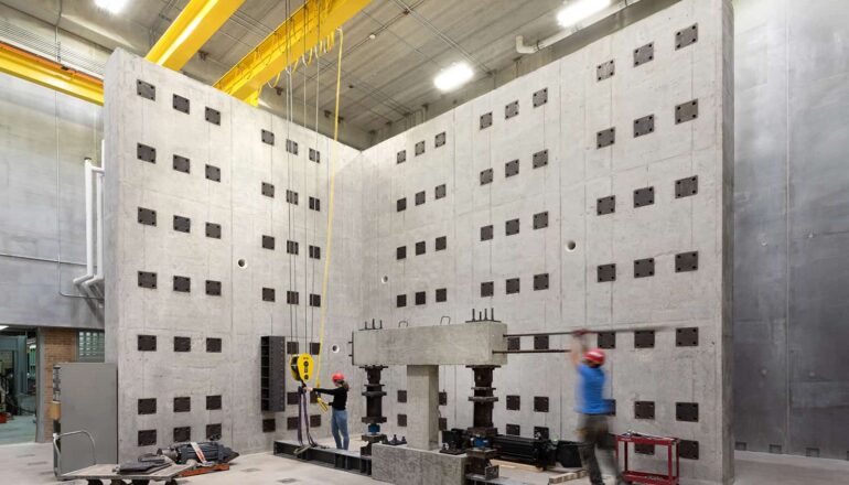 An overall view of the materials and structures testing laboratory with engineering students.