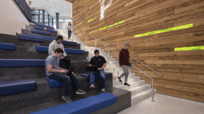 Students utilize the open seating in the Sesquicentennial Hall main staircase.