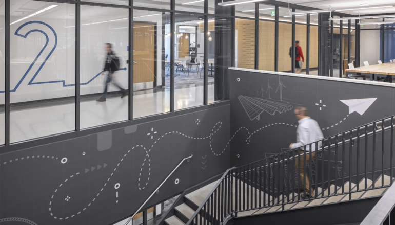 A gray and white wall graphic enhances the learning spaces in Sesquicentennial Hall.