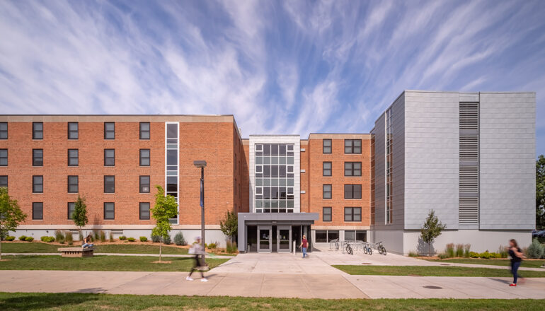 Head-on exterior view of the main North Residence Hall entry and overall building