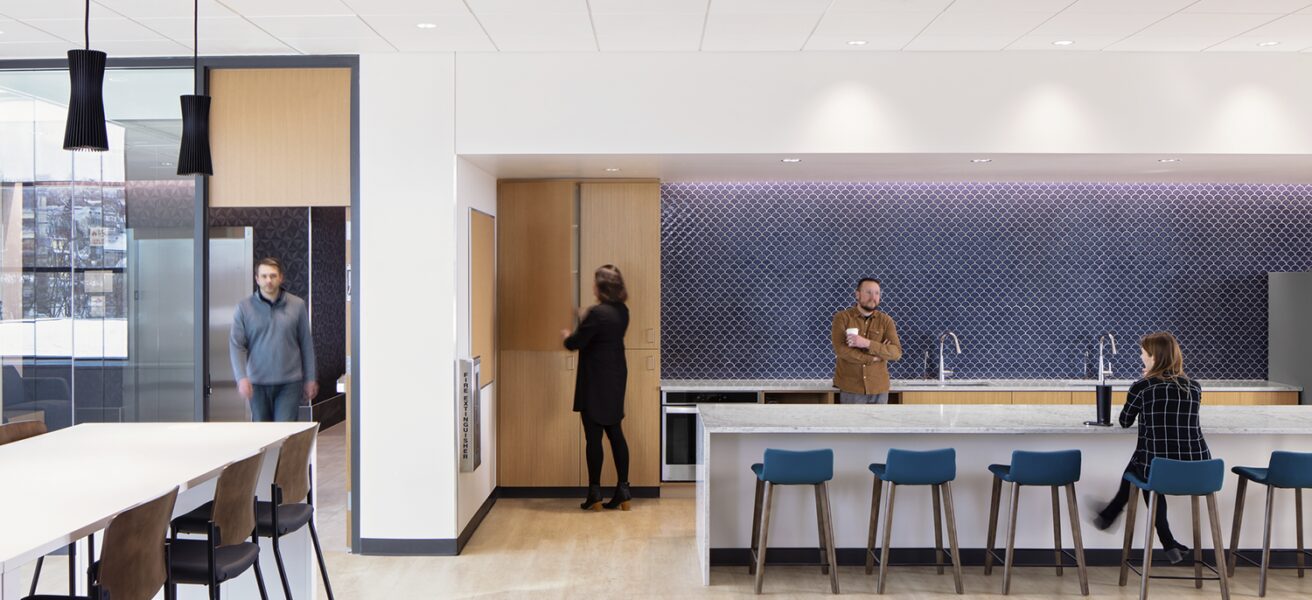 The work cafe with drop-in seating and a blue backsplash.