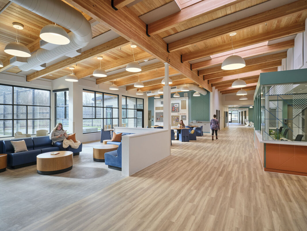 People utilize the community space in the Maple Lane facility.